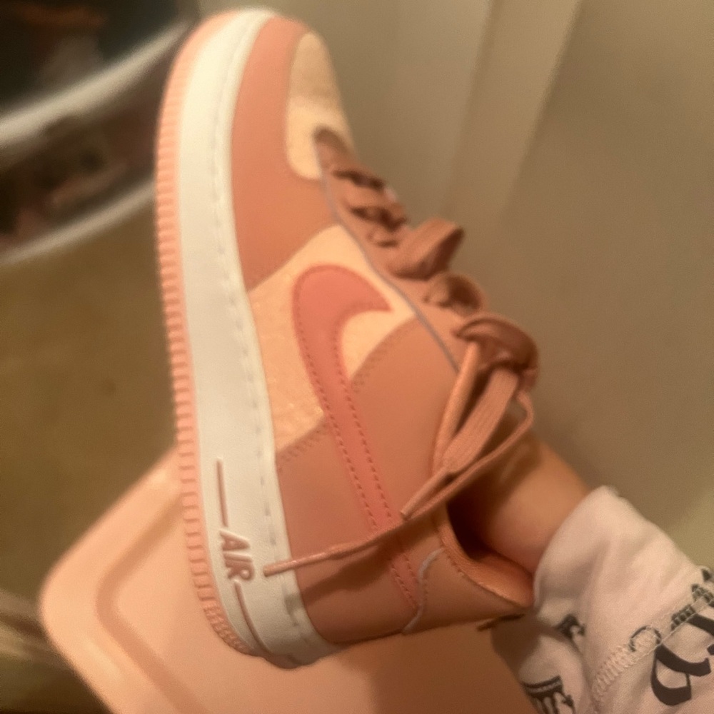 Pink and white Nike air Force one